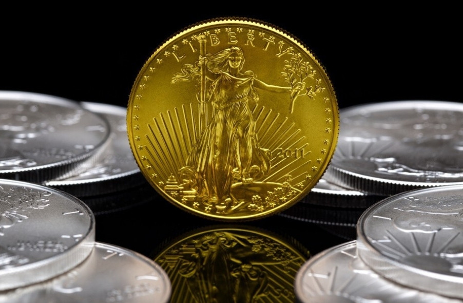 a gold coin surrounded by silver coins