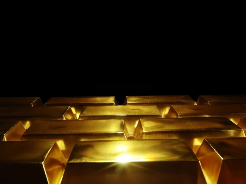 gold bars in a dark room