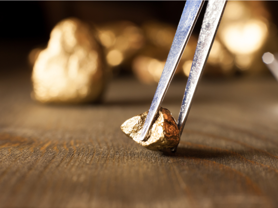 a gold nugget being check for its authenticity