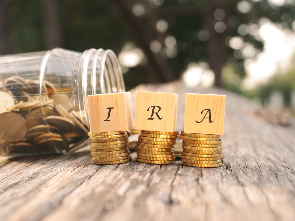 ira letters on top of gold coins
