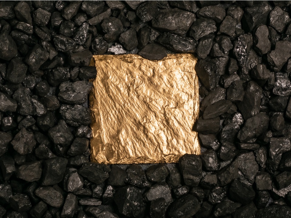 a gold plated metal under coal