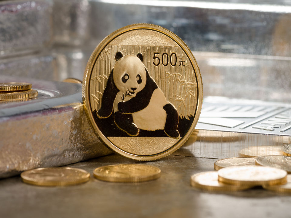 panda gold coin with silver bars on the side