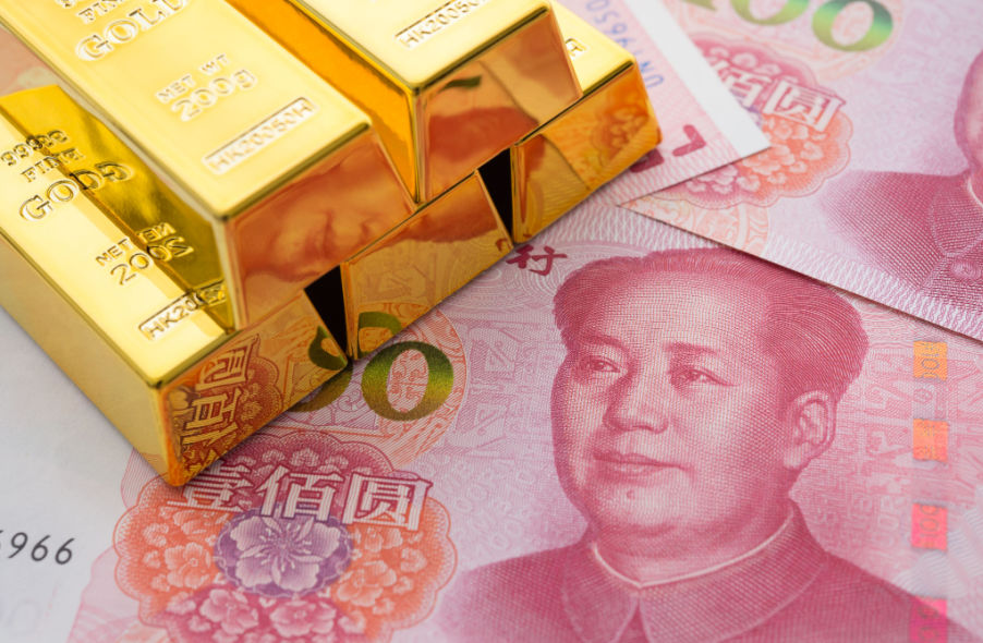 gold bars on chinese yuan bills