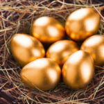 golden eggs sitting in nest