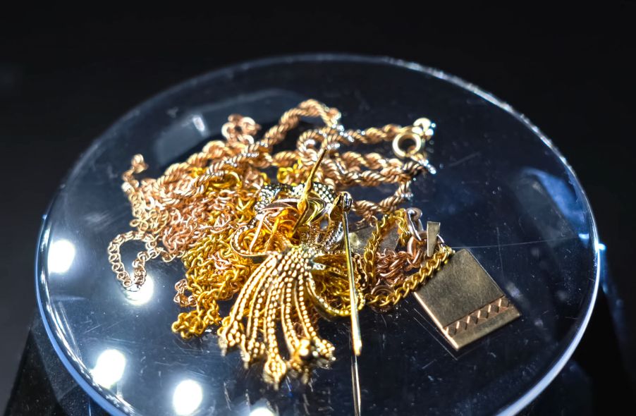 gold filled and gold plated jewelries on glass plate