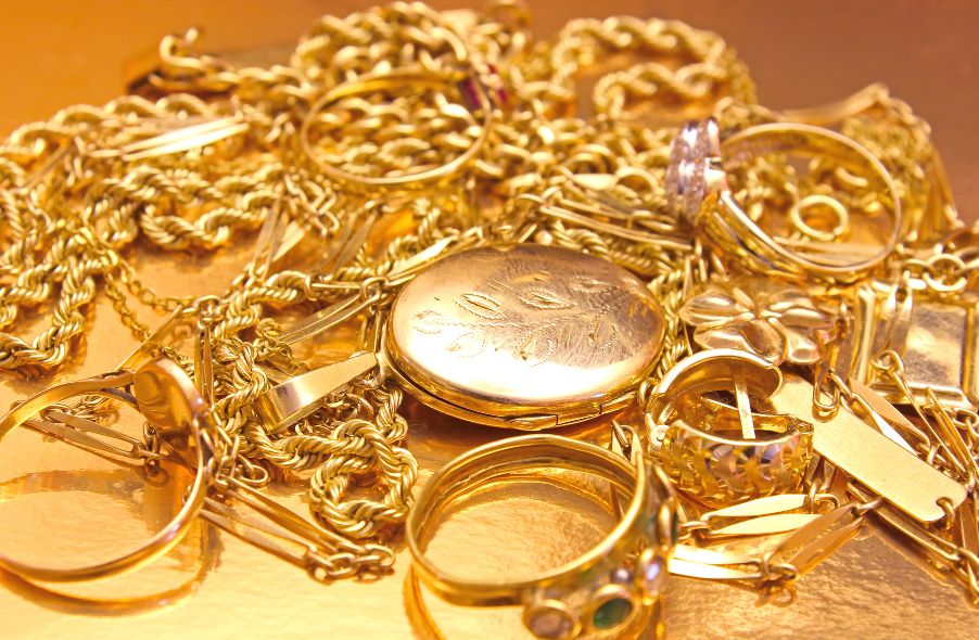 pile of different types of gold jewelries